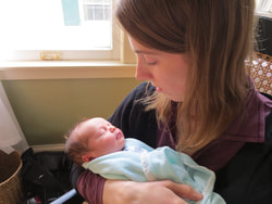 Jaime Healy-Plotkin Postpartum Doula with a newborn
